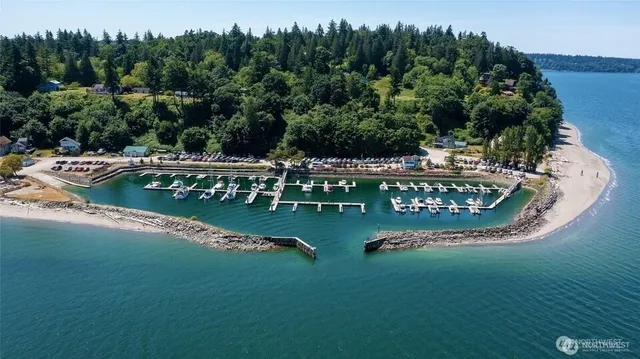a view of a wooden deck with lake view