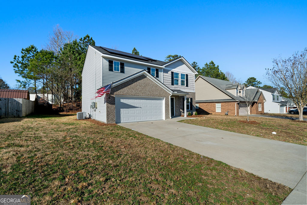 21 Walton Creek Drive Southwest Rome, GA 30165 - Photo 2 of 26 a front view of a house with a yard and garage