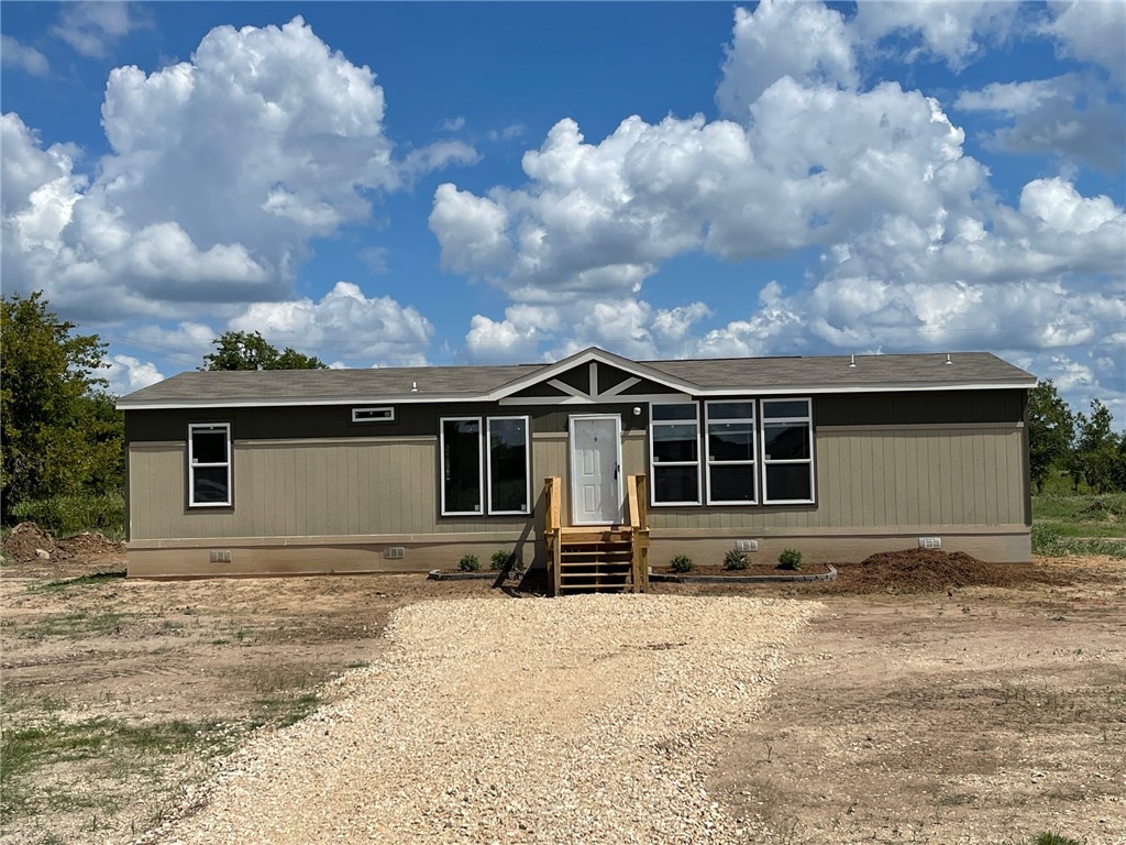 a front view of a house with yard