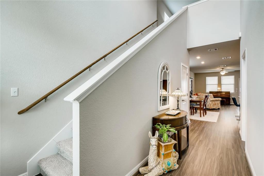 105 Tucana Street Georgetown, TX 78628 - Photo 2 of 17 Stairs featuring wood finished floors and a high ceiling
