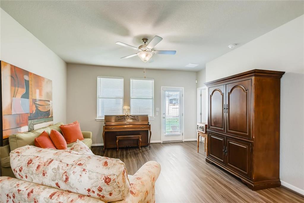 105 Tucana Street Georgetown, TX 78628 - Photo 4 of 17 Living area with light wood-style flooring and a ceiling fan
