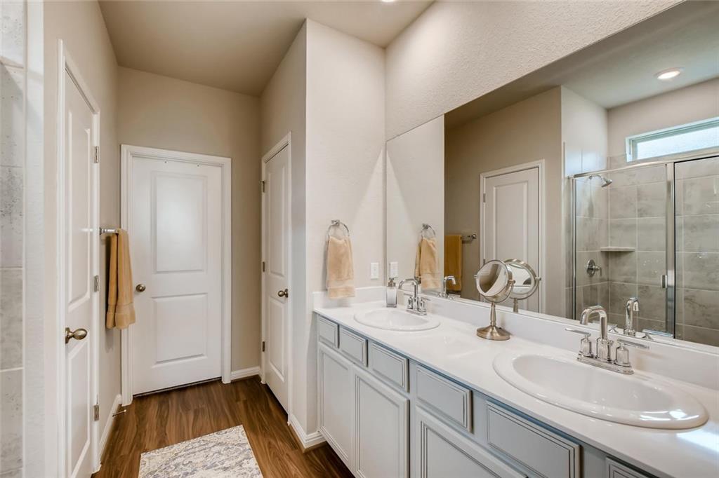 105 Tucana Street Georgetown, TX 78628 - Photo 8 of 17 Full bathroom with a stall shower and double vanity