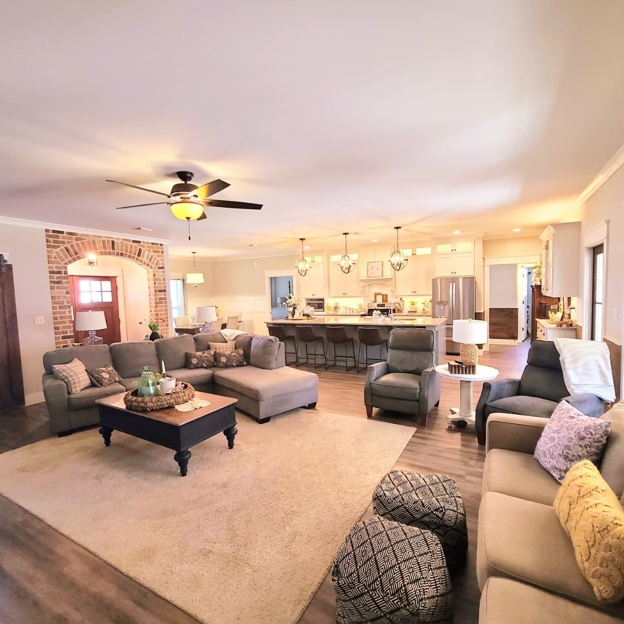10051 Blackwell Nursery Road Semmes, AL 36575 - Photo 41 of 54 Living room featuring ornamental molding, light wood-style flooring, plenty of natural light, a ceiling fan, and suspended lighting