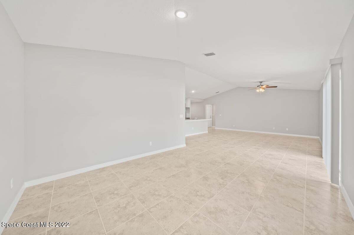 1111 Ver Circle Northeast Palm Bay, FL 32905 - Photo 12 of 30 an empty room with an entryway and cabinet