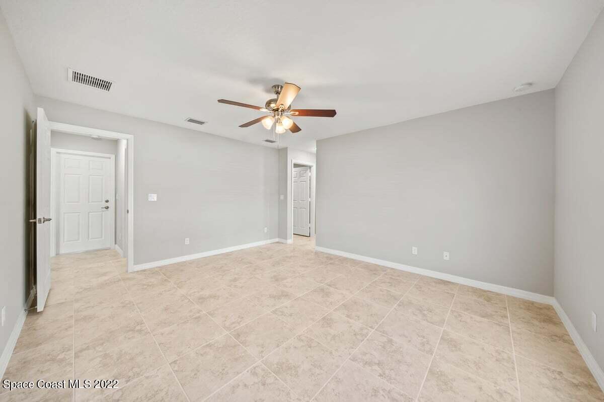 1111 Ver Circle Northeast Palm Bay, FL 32905 - Photo 17 of 30 a view of a big room with carpet