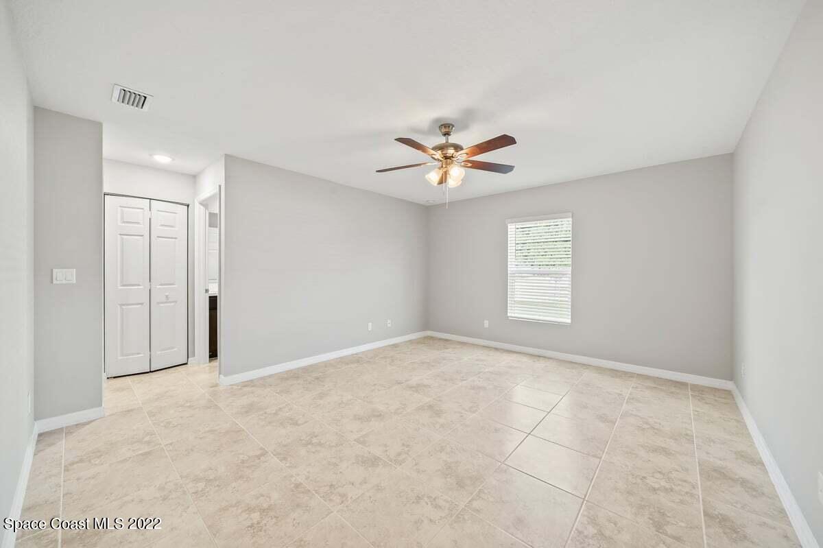 1111 Ver Circle Northeast Palm Bay, FL 32905 - Photo 18 of 30 a view of an empty room with a window