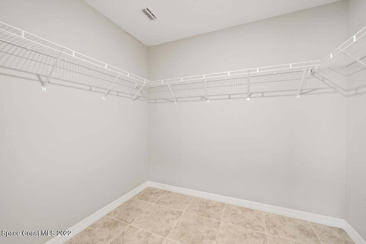 1111 Ver Circle Northeast Palm Bay, FL 32905 - Photo 21 of 30 a view of a room with racks on the wall