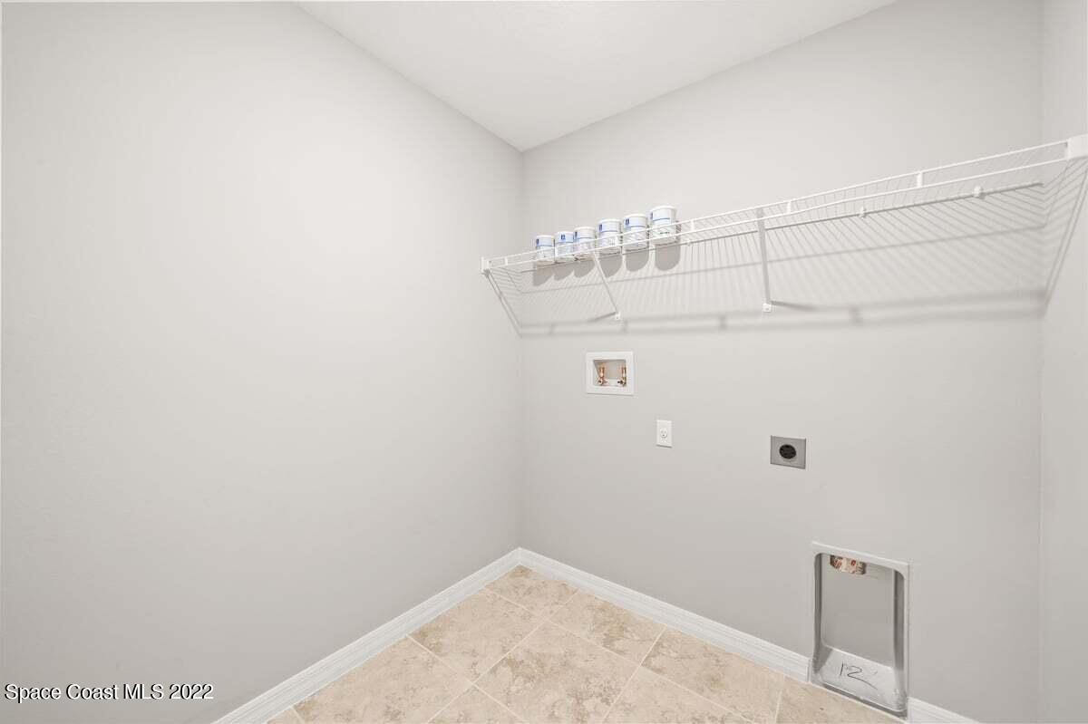 1111 Ver Circle Northeast Palm Bay, FL 32905 - Photo 26 of 30 a bathroom with a sink