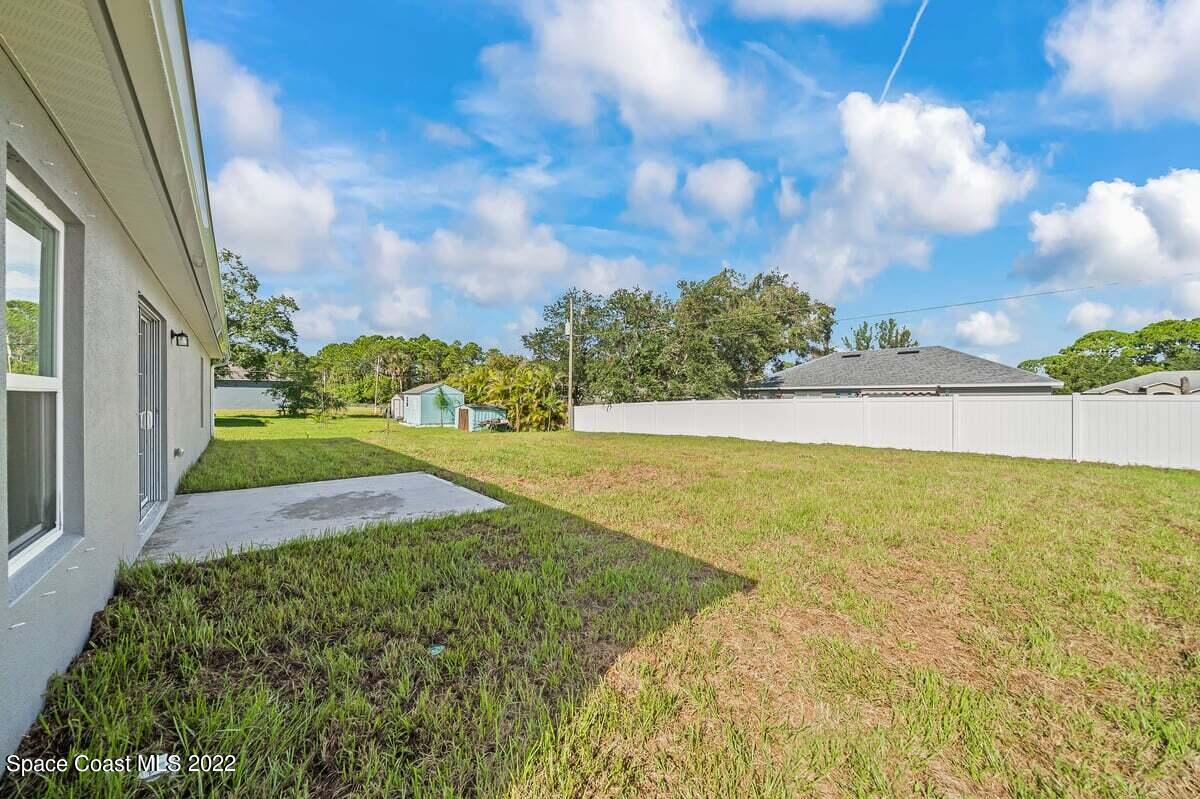 1111 Ver Circle Northeast Palm Bay, FL 32905 - Photo 27 of 30 a view of yard with swimming pool and green space