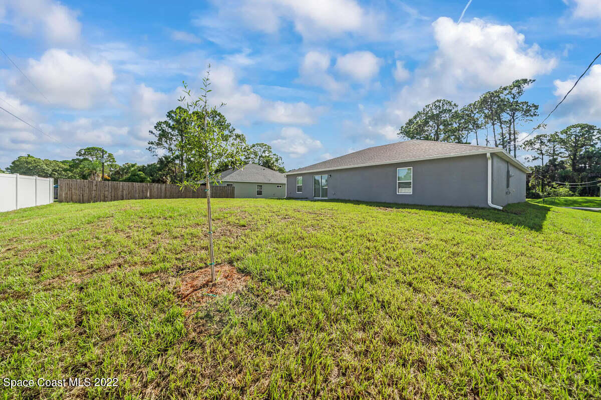1111 Ver Circle Northeast Palm Bay, FL 32905 - Photo 28 of 30 a view of a field with a big yard