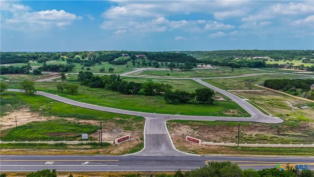 an aerial view of a houses with outdoor space and street view