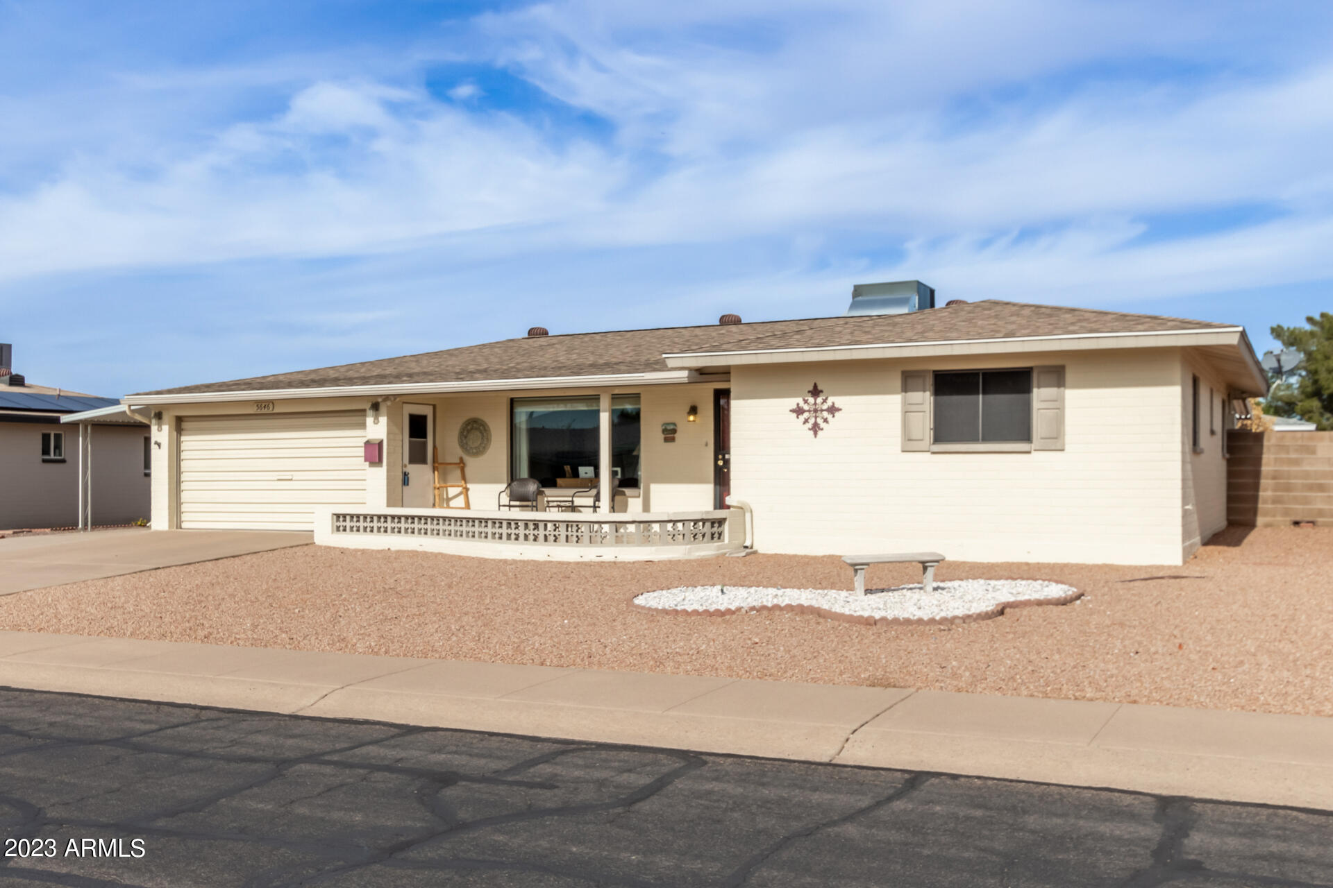 5646 East Decatur Street Mesa, AZ 85205 - Photo 3 of 51 a front view of a house with a yard