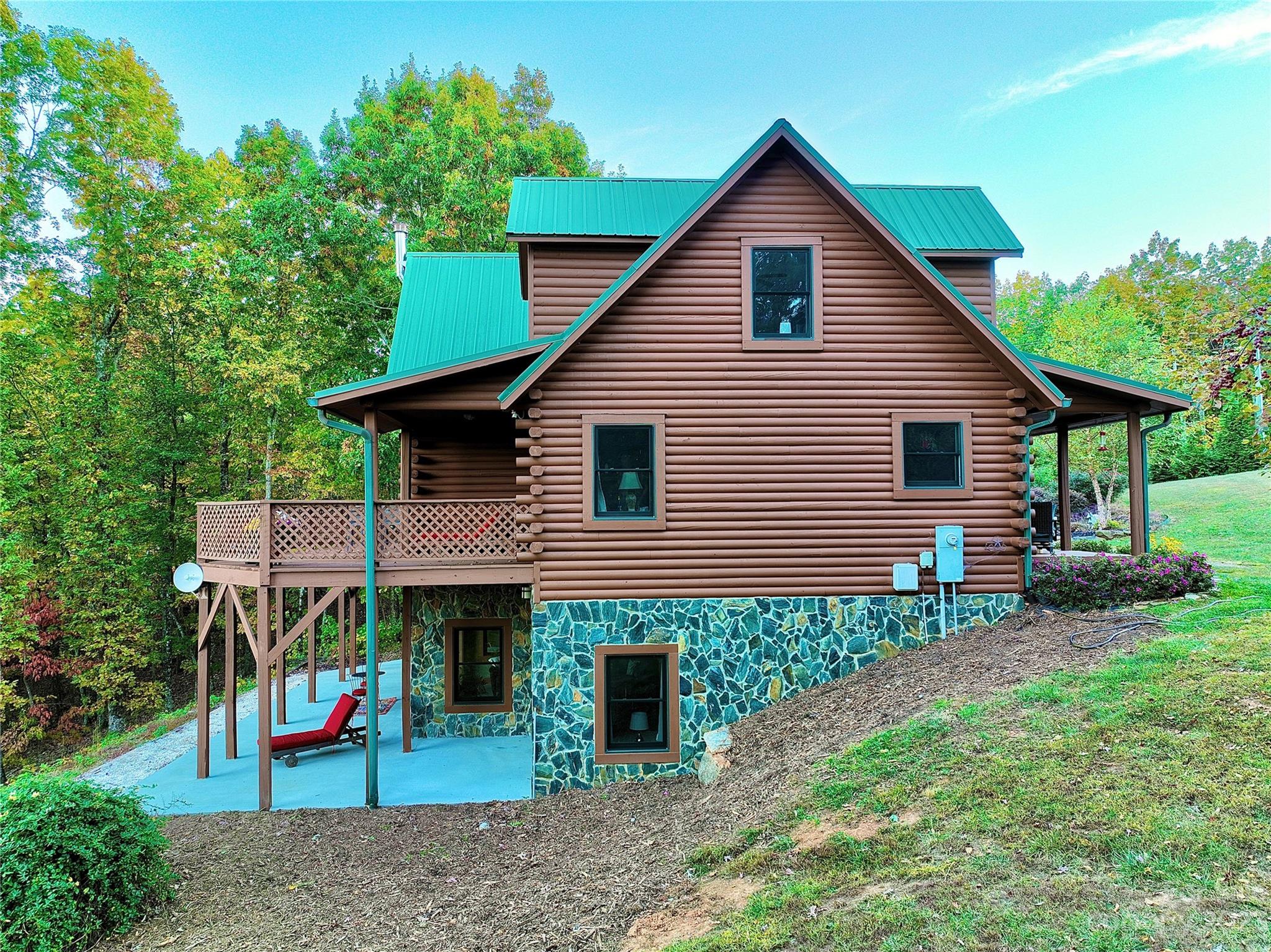 3703 Back Bluff Drive Morganton, NC 28655 - Photo 14 of 48 a view of a house with a yard and potted plants