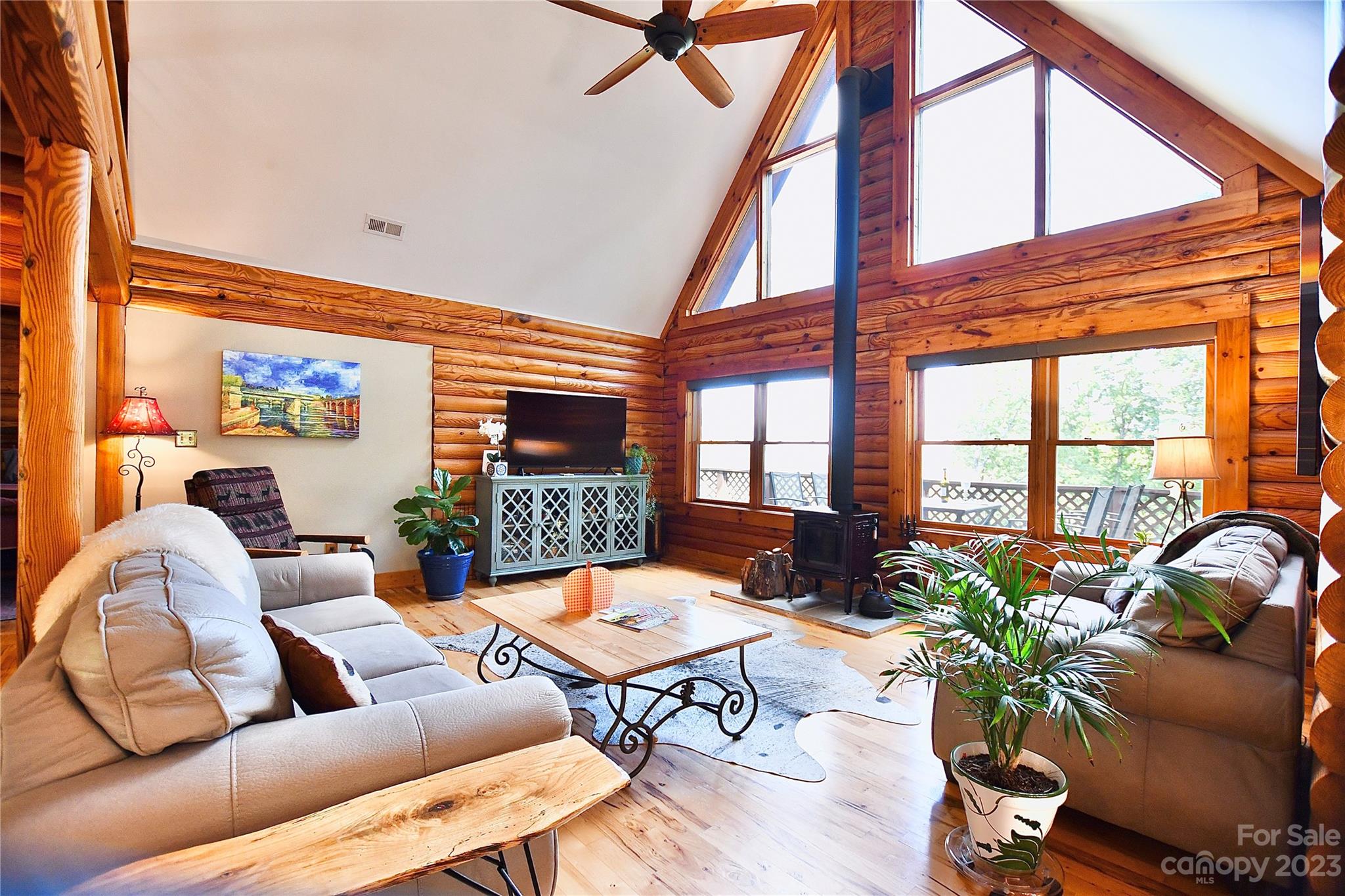 3703 Back Bluff Drive Morganton, NC 28655 - Photo 15 of 48 a living room with furniture plant and a large window
