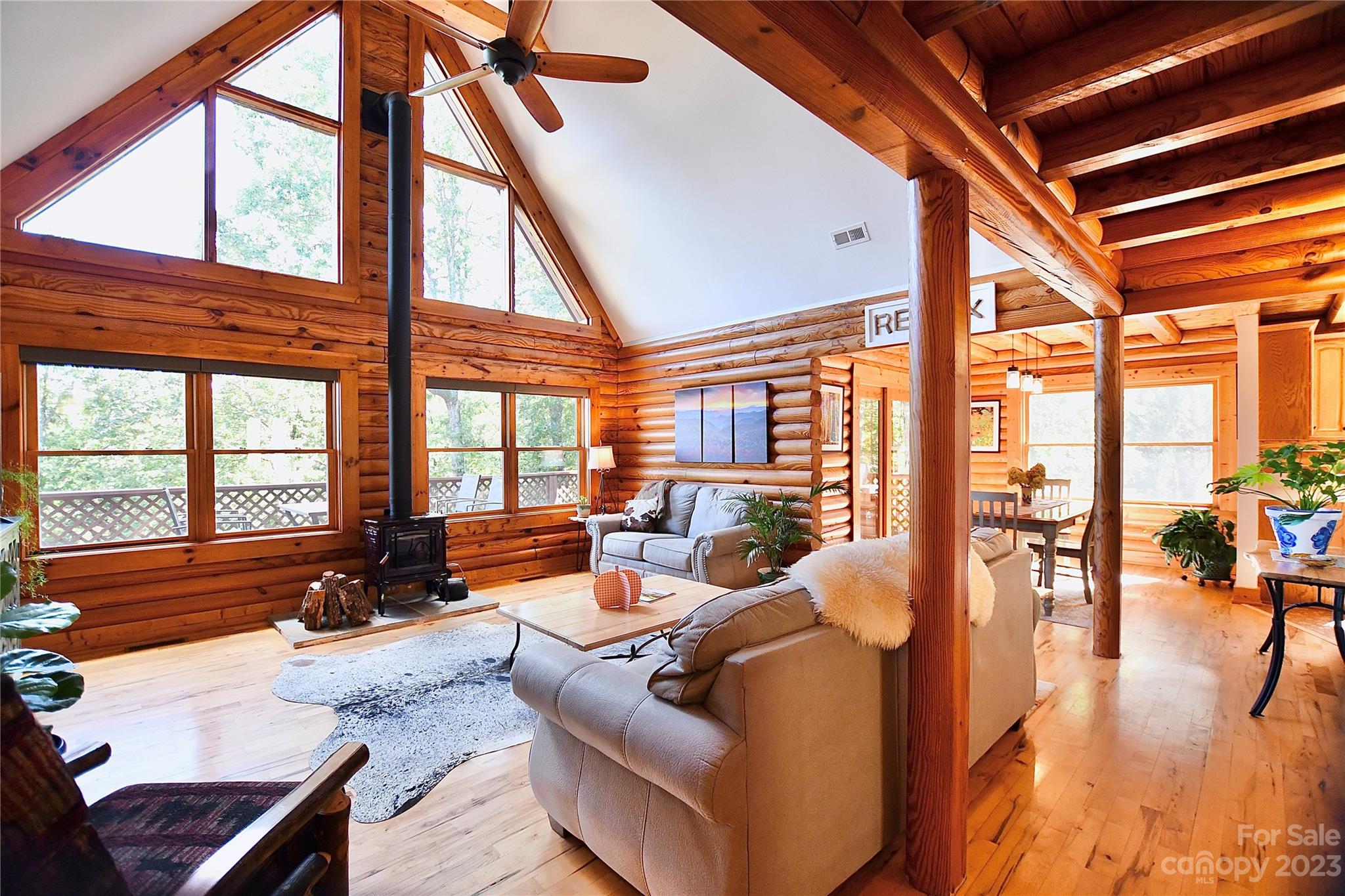3703 Back Bluff Drive Morganton, NC 28655 - Photo 16 of 48 a living room with furniture and floor to ceiling windows
