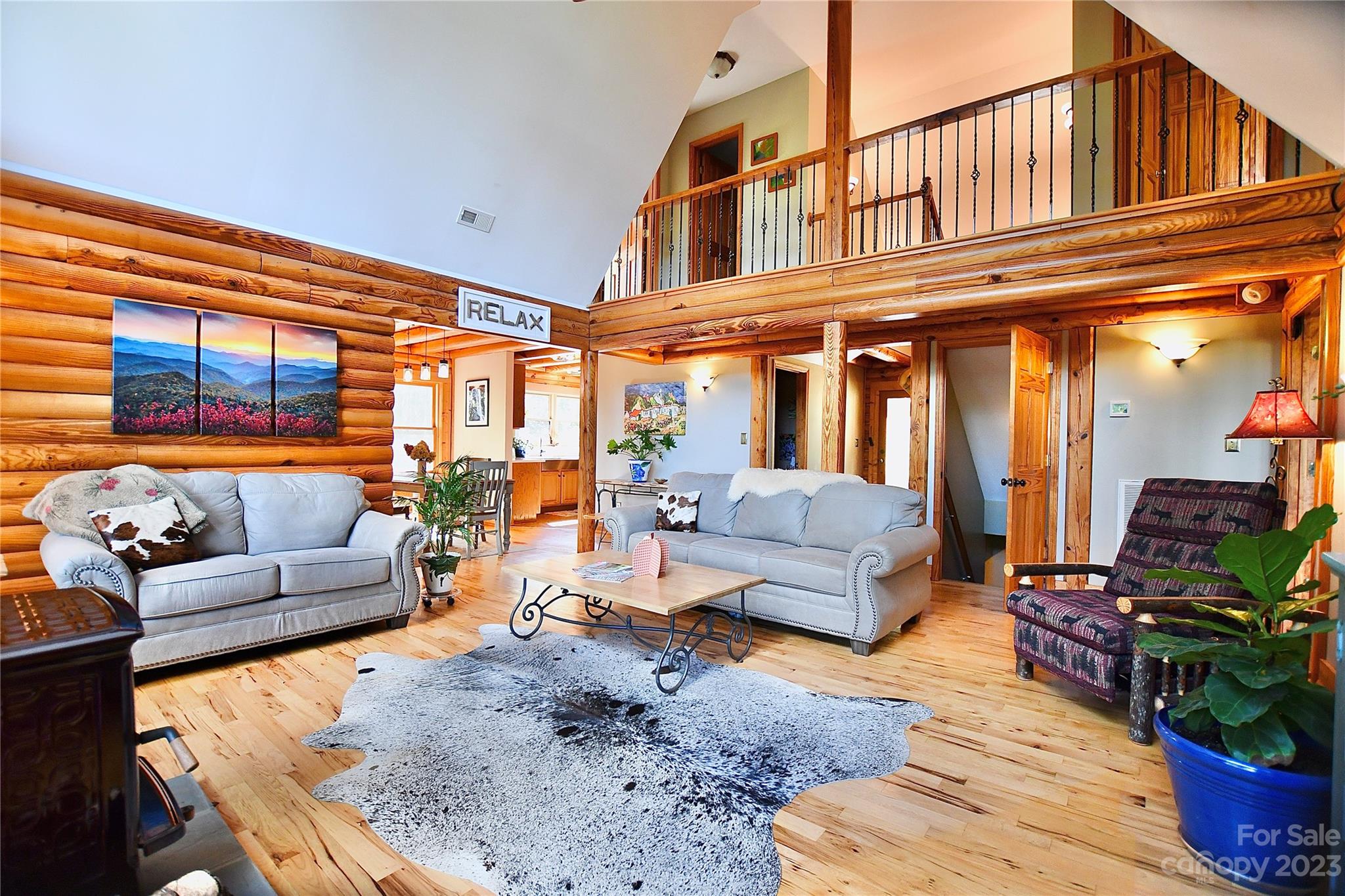 3703 Back Bluff Drive Morganton, NC 28655 - Photo 17 of 48 a living room with furniture or couch and a potted plant
