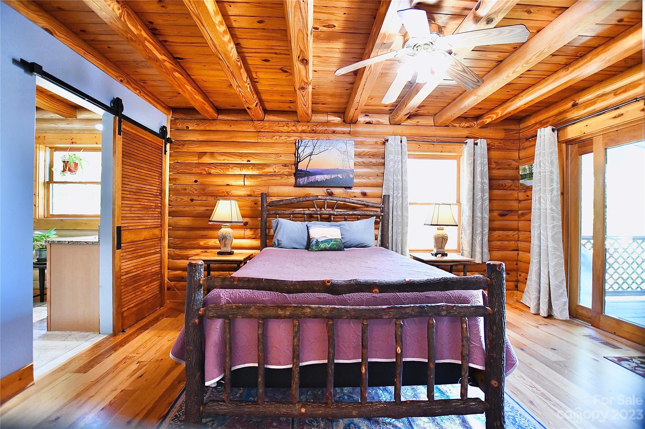 3703 Back Bluff Drive Morganton, NC 28655 - Photo 27 of 48 a bedroom with a bed and wooden floor