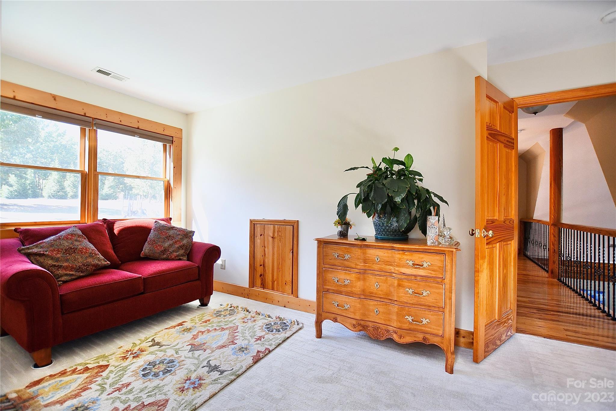 3703 Back Bluff Drive Morganton, NC 28655 - Photo 34 of 48 a living room with furniture a bed and a dresser next to a window