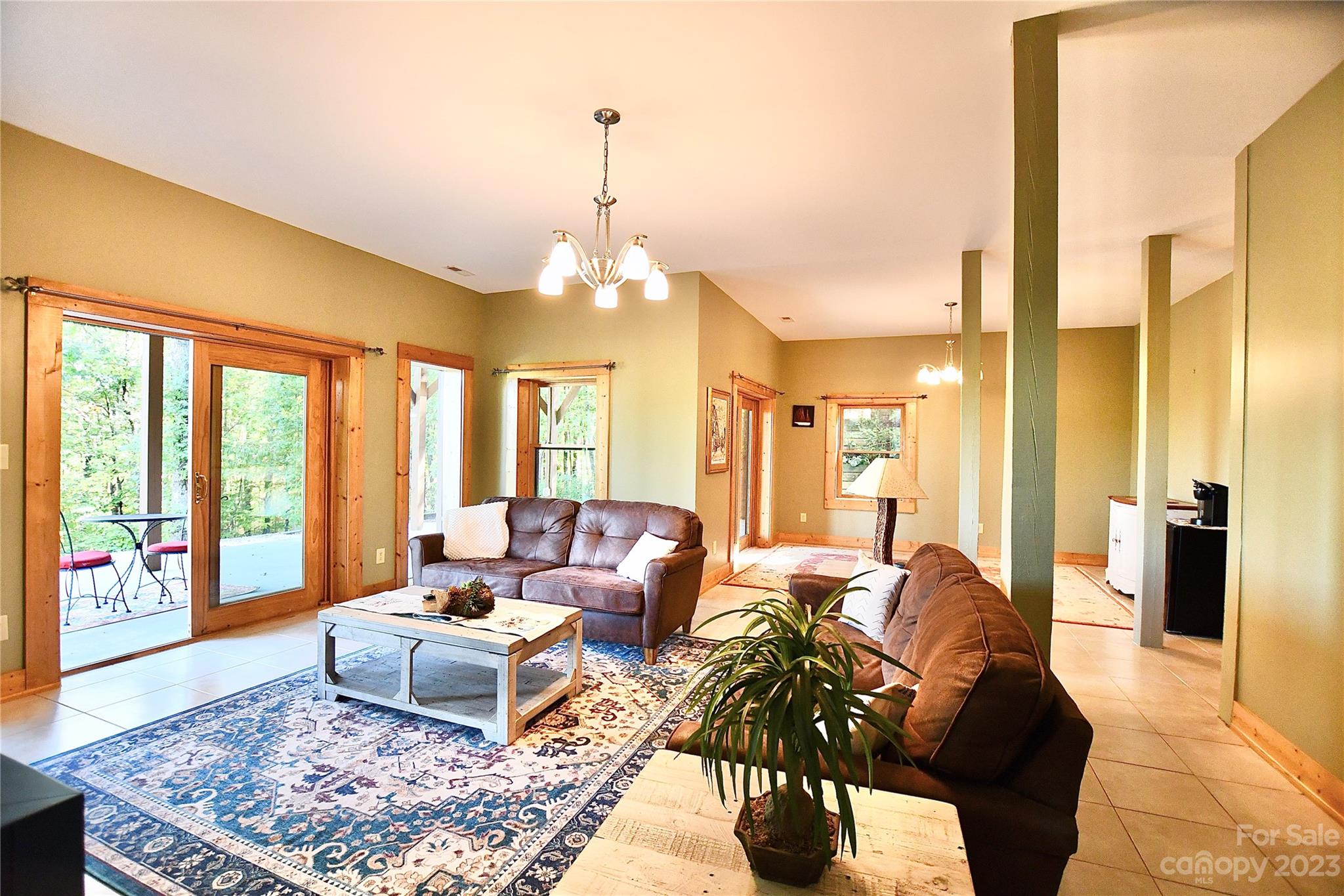 3703 Back Bluff Drive Morganton, NC 28655 - Photo 44 of 48 a living room with furniture and a chandelier
