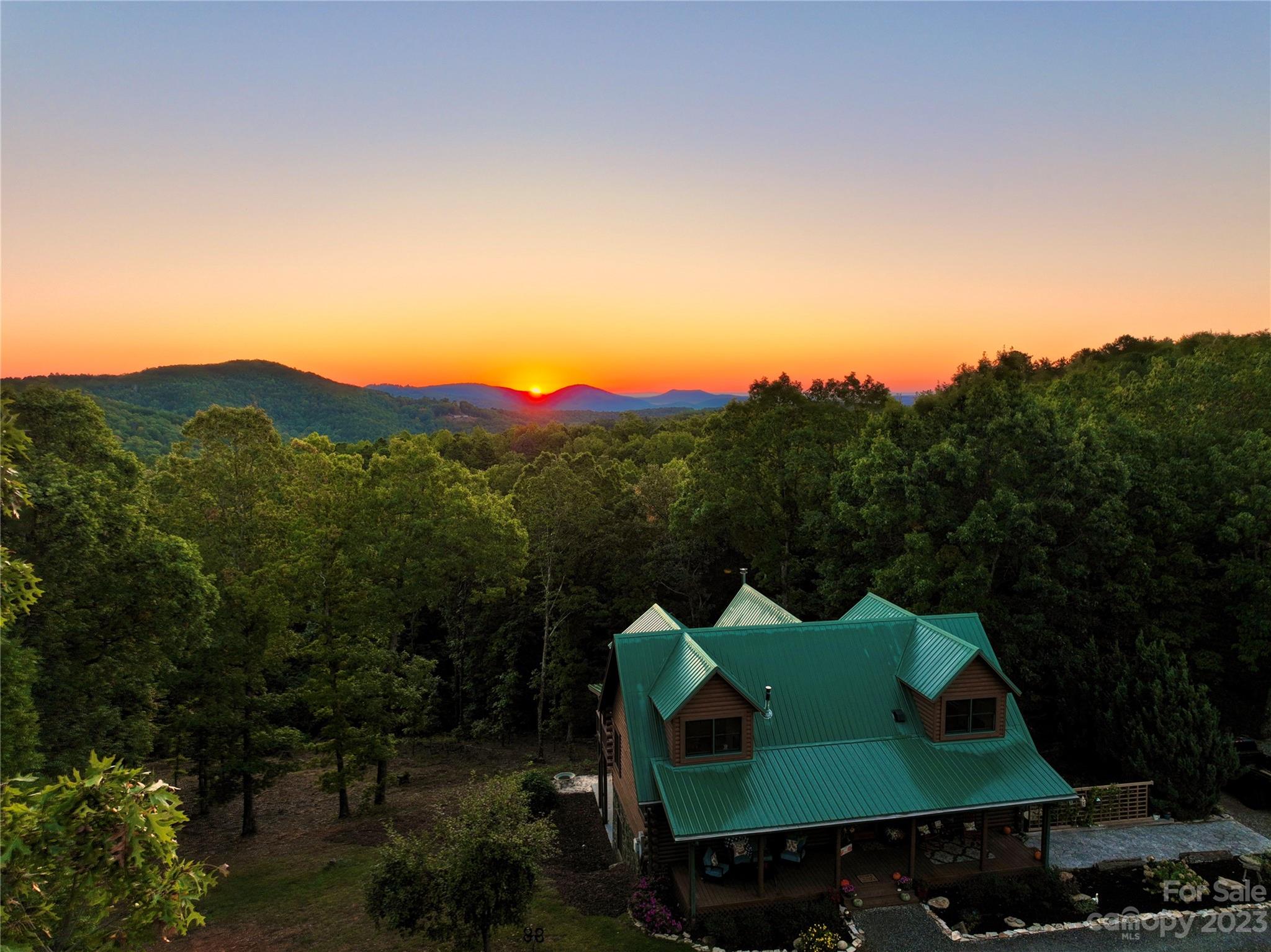 3703 Back Bluff Drive Morganton, NC 28655 - Photo 5 of 48 a view of a green mountain in the distance in a yard