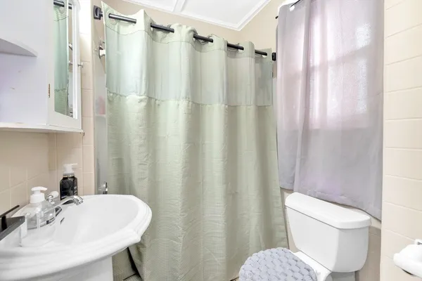 a kitchen with stainless steel appliances a refrigerator sink and cabinets