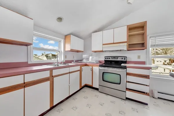 a kitchen with stainless steel appliances granite countertop a stove a sink dishwasher and a refrigerator