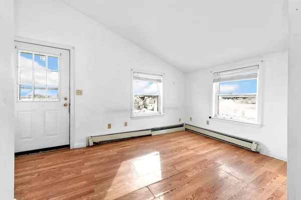 a view of wooden floor in an empty room