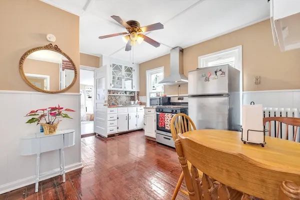 a kitchen with stainless steel appliances granite countertop a stove and a refrigerator