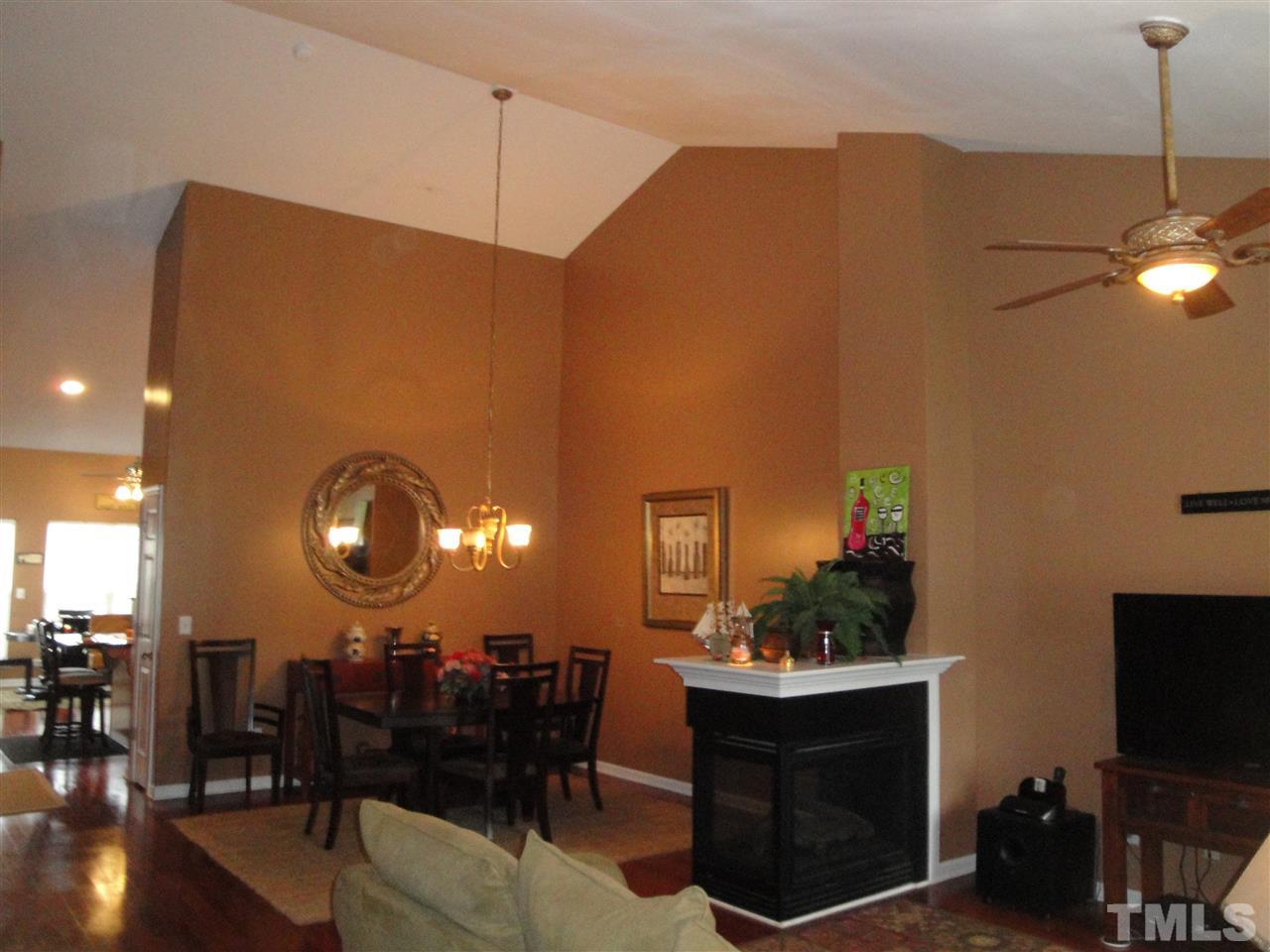12006 Fox Valley Street Raleigh, NC 27614 - Photo 6 of 25 a view of a dining room with furniture and wooden floor