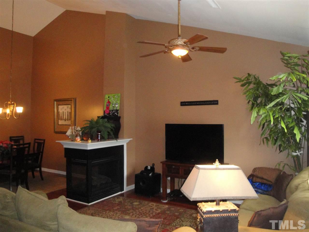 12006 Fox Valley Street Raleigh, NC 27614 - Photo 9 of 25 a living room with furniture and a fireplace