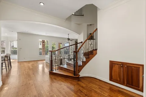 a view of entryway and hall with wooden floor