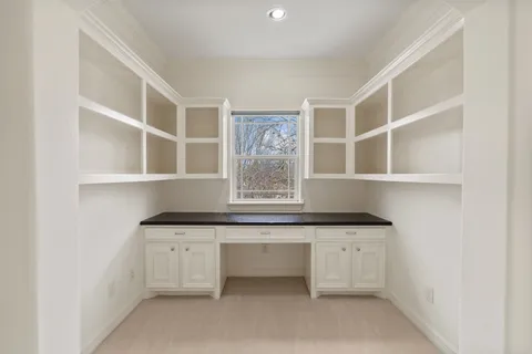 a view white cabinets and a sink