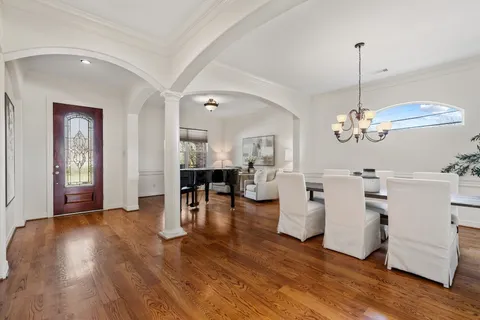 a view of a livingroom with furniture and a chandelier