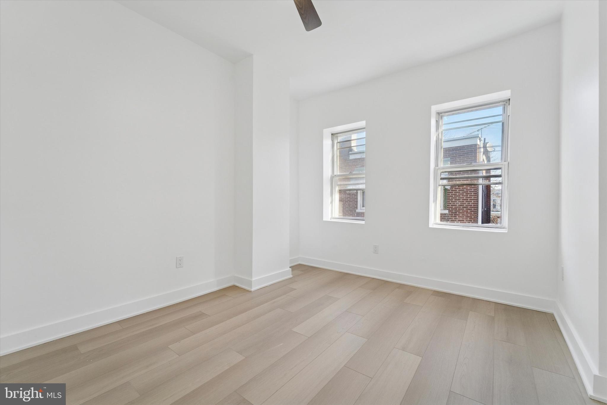 537 North Wanamaker Street Philadelphia, PA 19131 - Photo 21 of 37 an empty room with wooden floor and windows