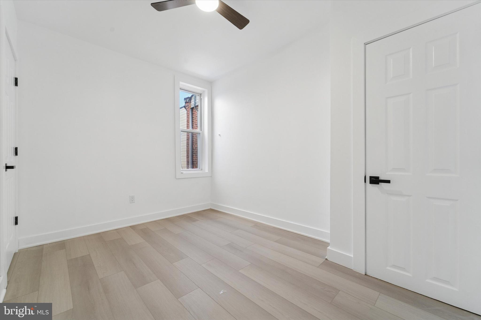 537 North Wanamaker Street Philadelphia, PA 19131 - Photo 25 of 37 an empty room with ceiling fan and windows