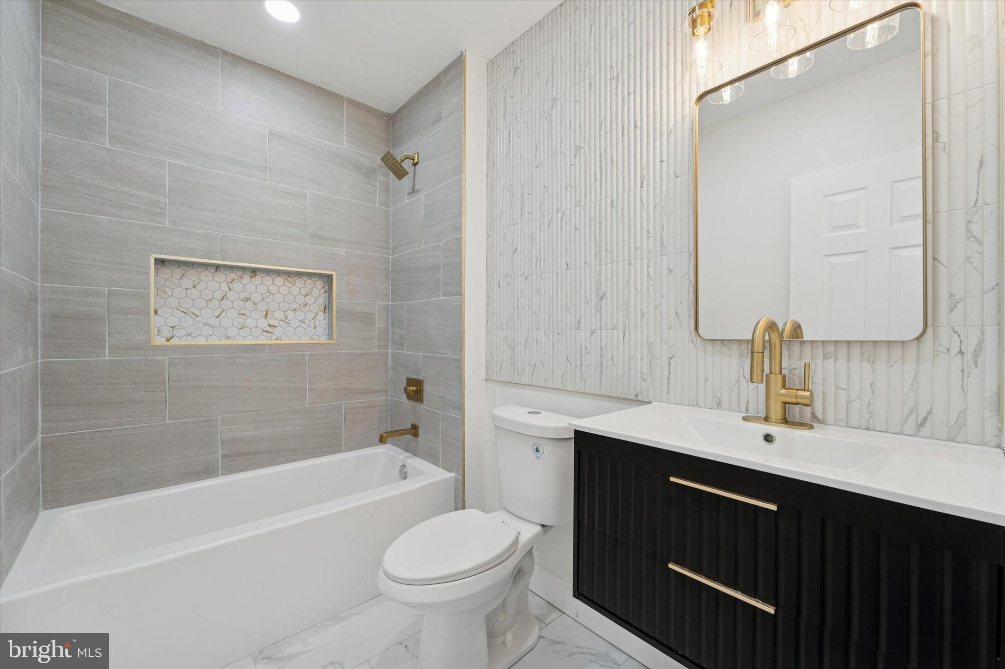 537 North Wanamaker Street Philadelphia, PA 19131 - Photo 26 of 37 a bathroom with a sink a toilet and shower