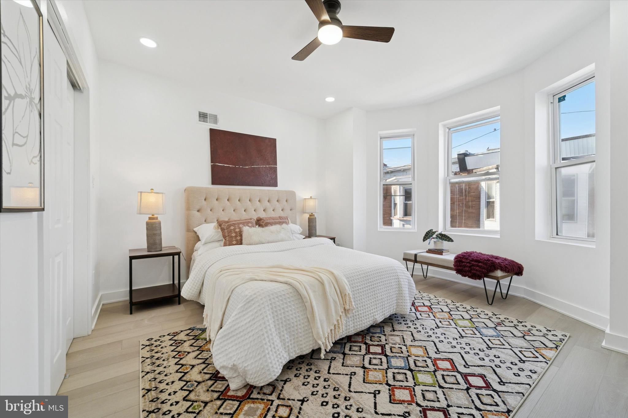 537 North Wanamaker Street Philadelphia, PA 19131 - Photo 28 of 37 a bedroom with a bed and wooden floor