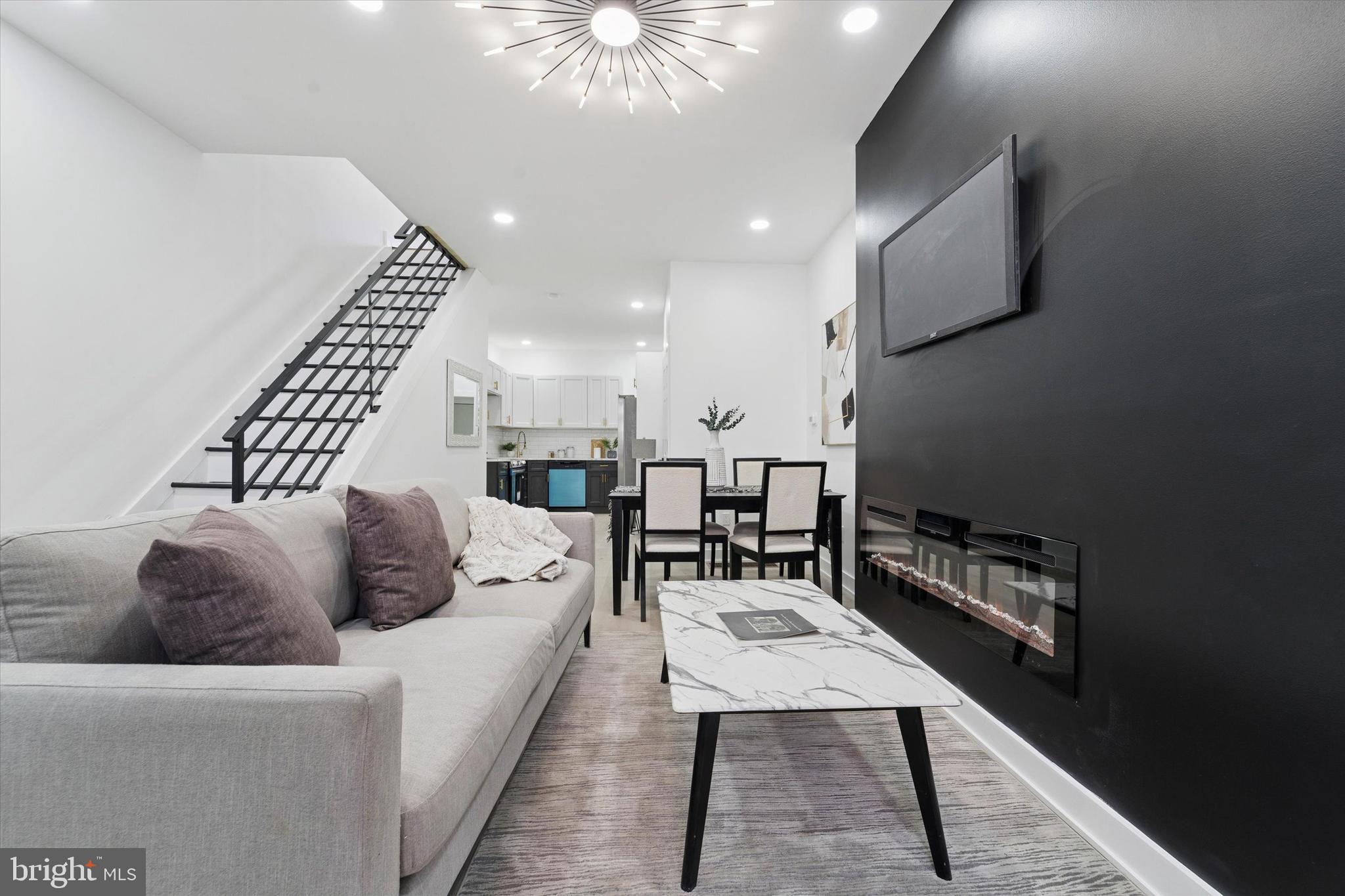 537 North Wanamaker Street Philadelphia, PA 19131 - Photo 6 of 37 a living room with furniture and a rug