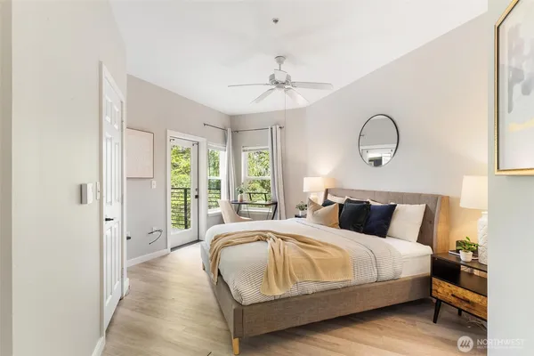 a bedroom with bed and a chandelier