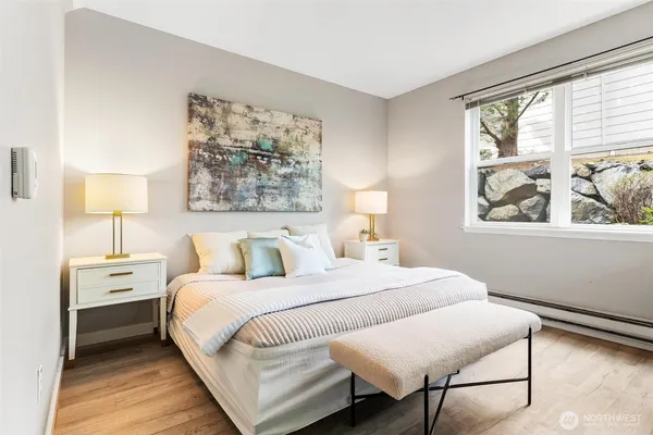 a bedroom with bed and a window