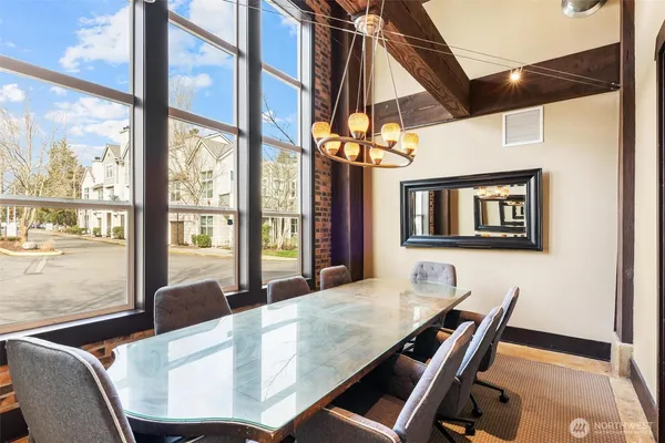 a dining room with furniture and window