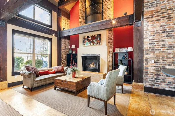 a outdoor living space with patio furniture and a fireplace