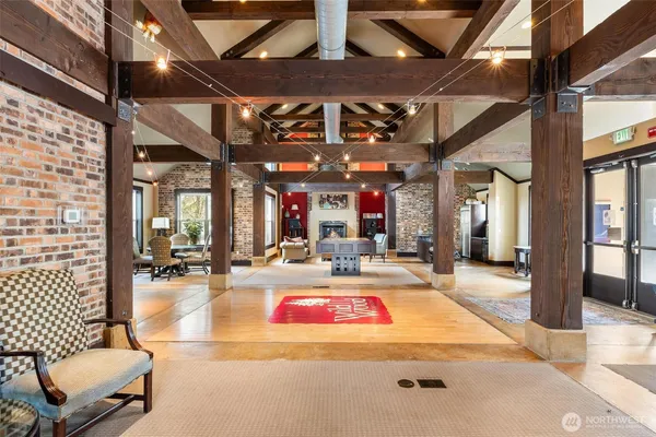 a living room with couch and a large window