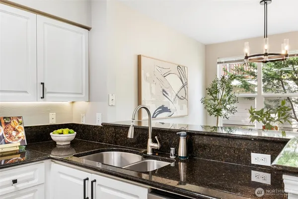 a kitchen with a sink and cabinets
