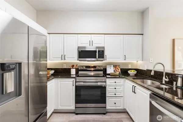 a kitchen with a stove and a microwave