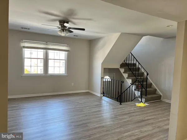 a view of an entryway with wooden floor