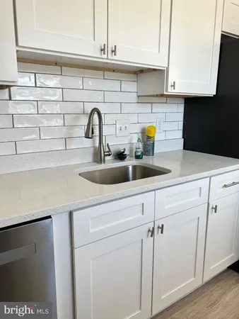 a kitchen with a sink and a stove