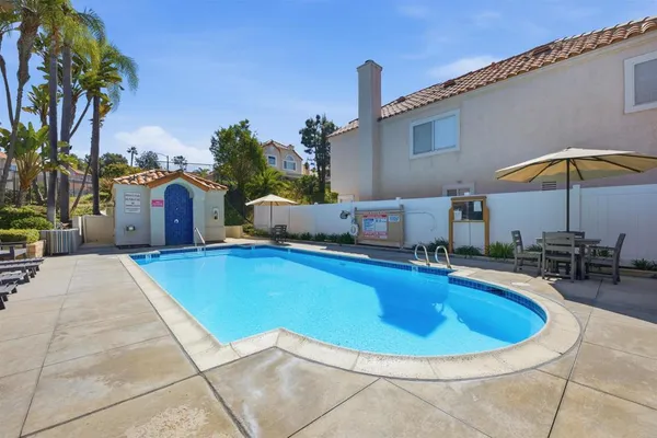 a view of a swimming pool with a patio