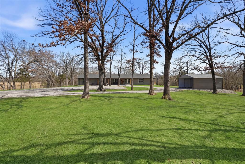 230 Frosty Hollow Road Denison, TX 75021 - Photo 1 of 40 Come Home and Experience the Best of Rustic Charm and Modern Comfort