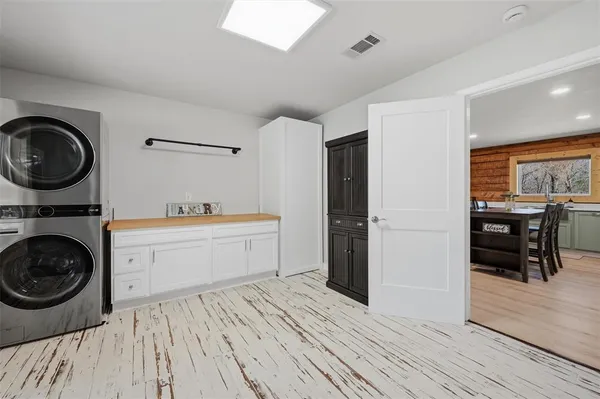 a kitchen that has a sink and a stove